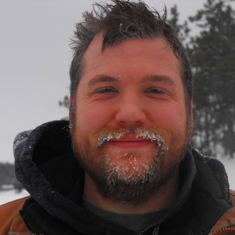Noel, the maker behind Geek Maille, with a face full of snow