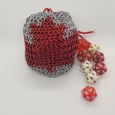 Large Maple Leaf Dice Bag – standing upright with red and white d20 dice spilling out